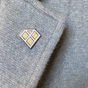 gem-x-lapel-pin-on-grey-lapel-800px